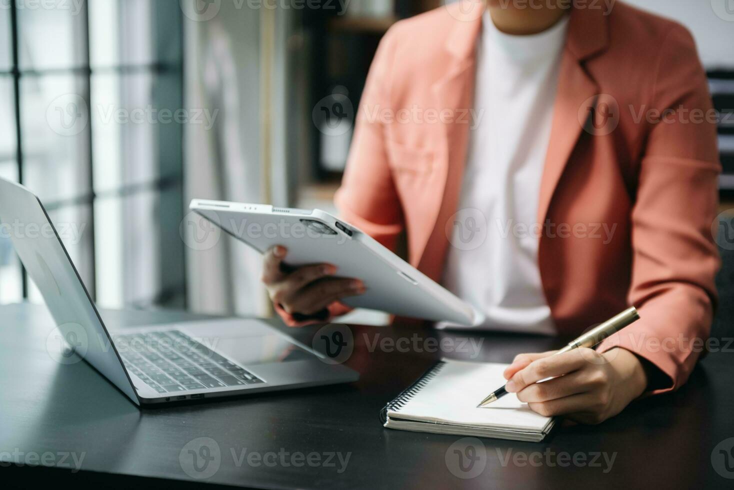 businesswoman hand working with new modern computer and writing on the notepad strategy diagram as concept photo