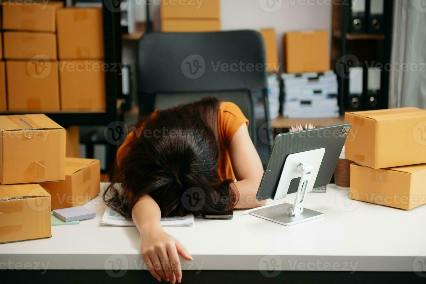 Asian woman SME working with a box at home the workplace.start-up small business owner, small business entrepreneur SME and delivery concept. photo