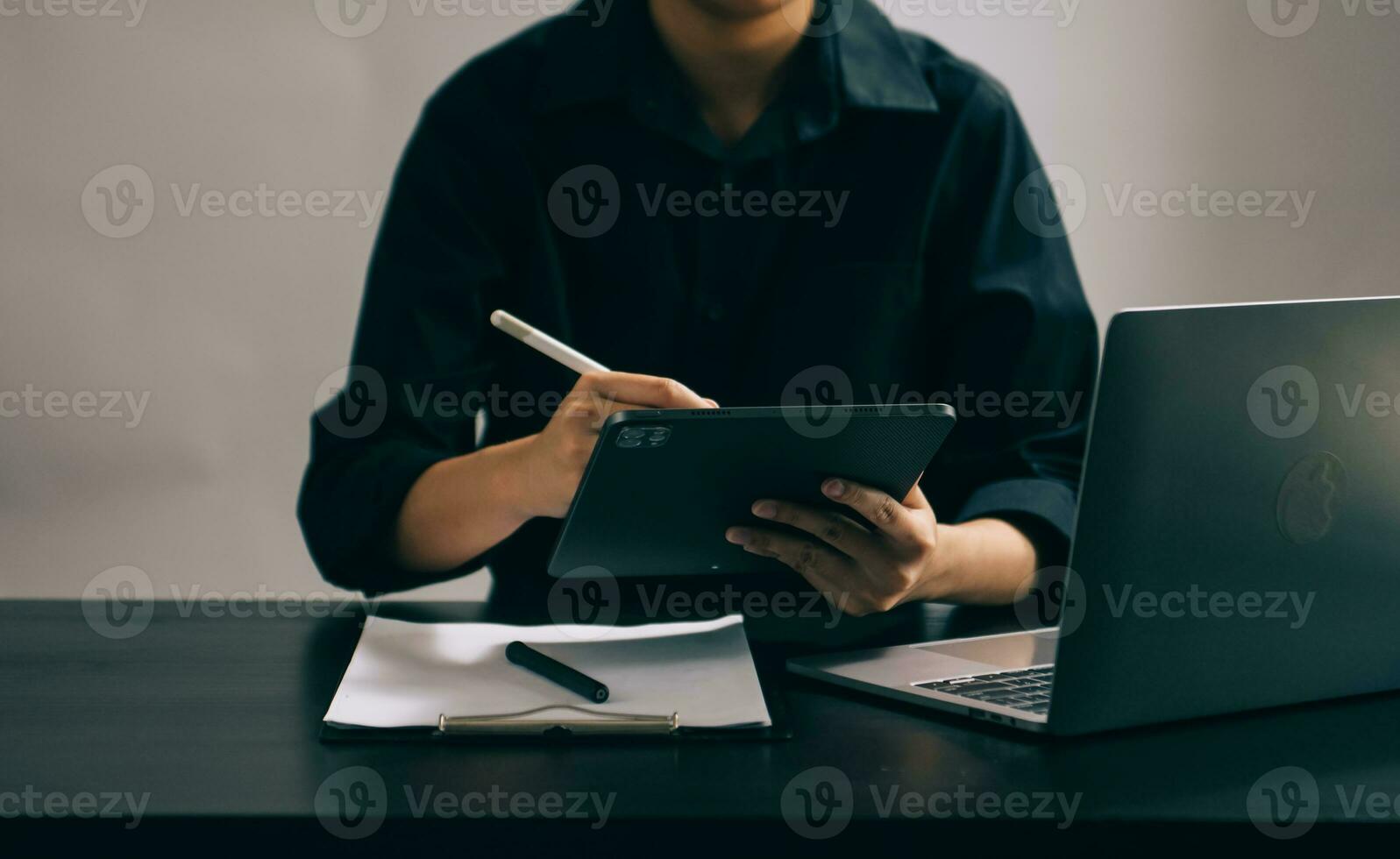 Businesswoman hand using laptop, tablet and smartphone in office. Digital marketing media mobile app and discussing plan new start up project. photo
