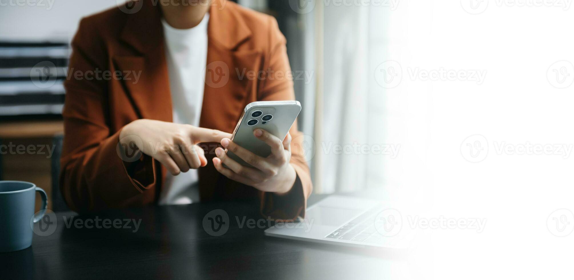 Businesswoman hand using laptop, tablet and smartphone in office. Digital marketing media mobile app and discussing plan new start up project. Finance task. photo