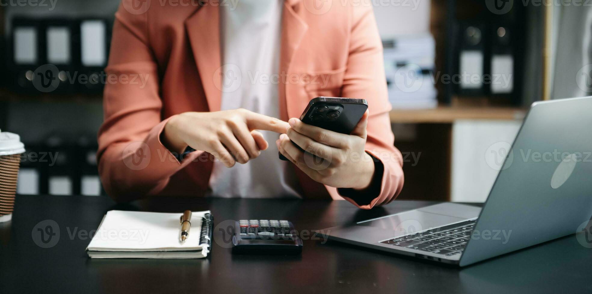 Businesswoman hand using laptop, tablet and smartphone in office. Digital marketing media mobile app and discussing plan new start up project. Finance task. photo