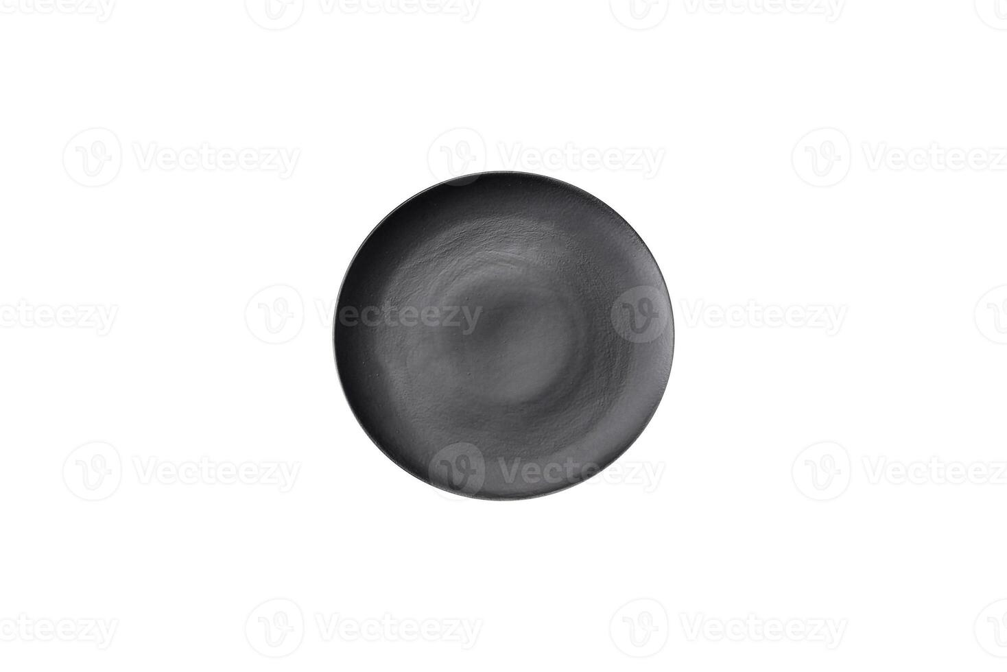 Empty ceramic round plate on dark textured concrete background photo