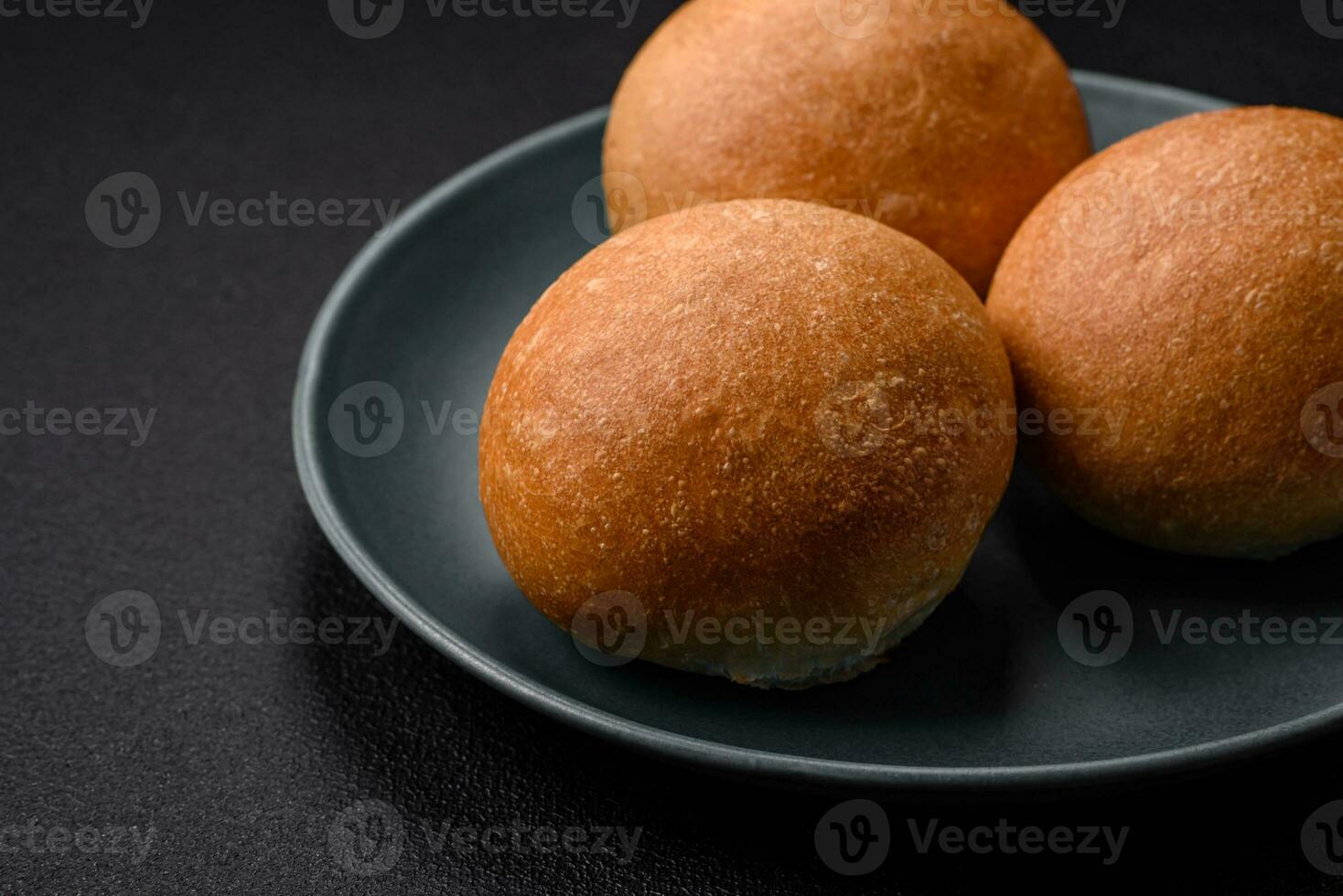 Delicious fresh crispy white round bread with seeds and grains photo