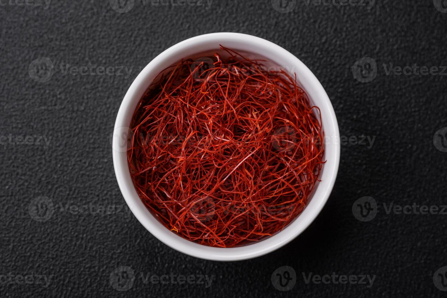 Red thin hot chili threads on a dark background photo