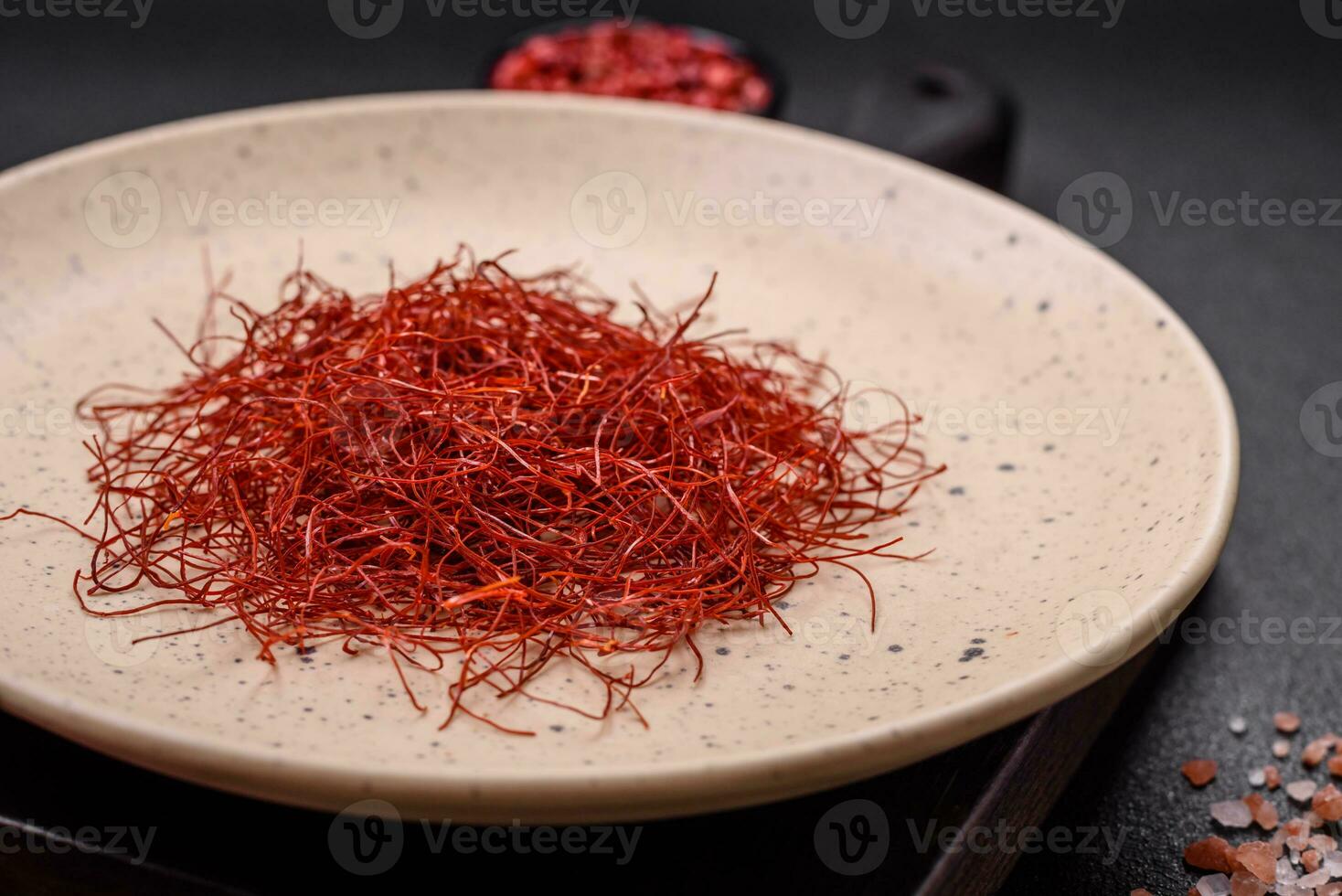 Red thin hot chili threads on a dark background photo