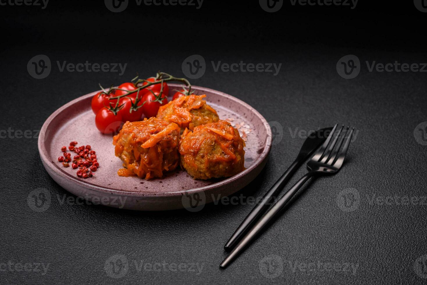 Delicious fresh meatballs from minced meat or fish with tomato sauce photo