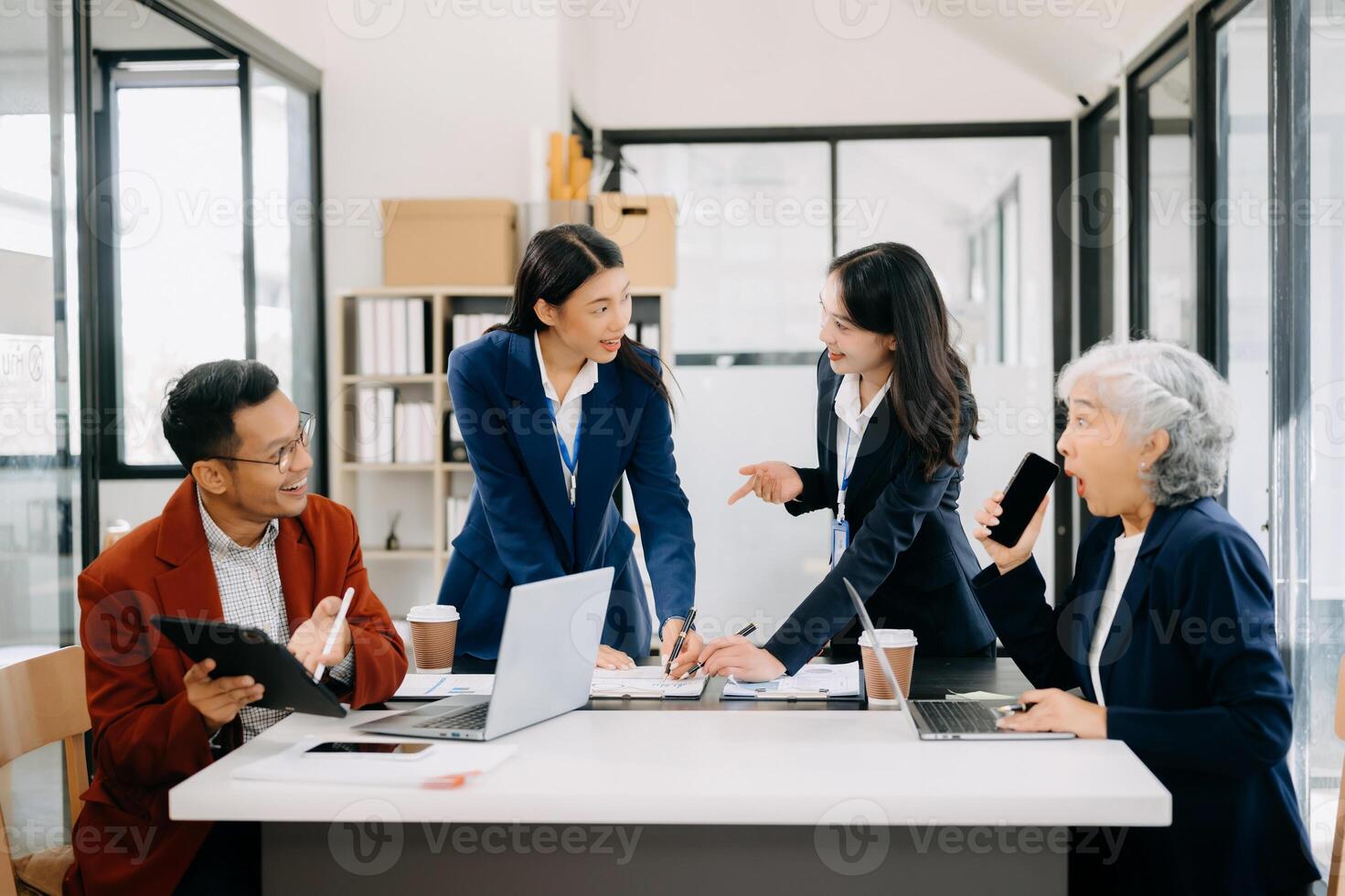 Business team discuss at meeting room. working together with laptop ,tablet and smart phone on desk Financial accountant , planner , meeting , introduction concept. photo