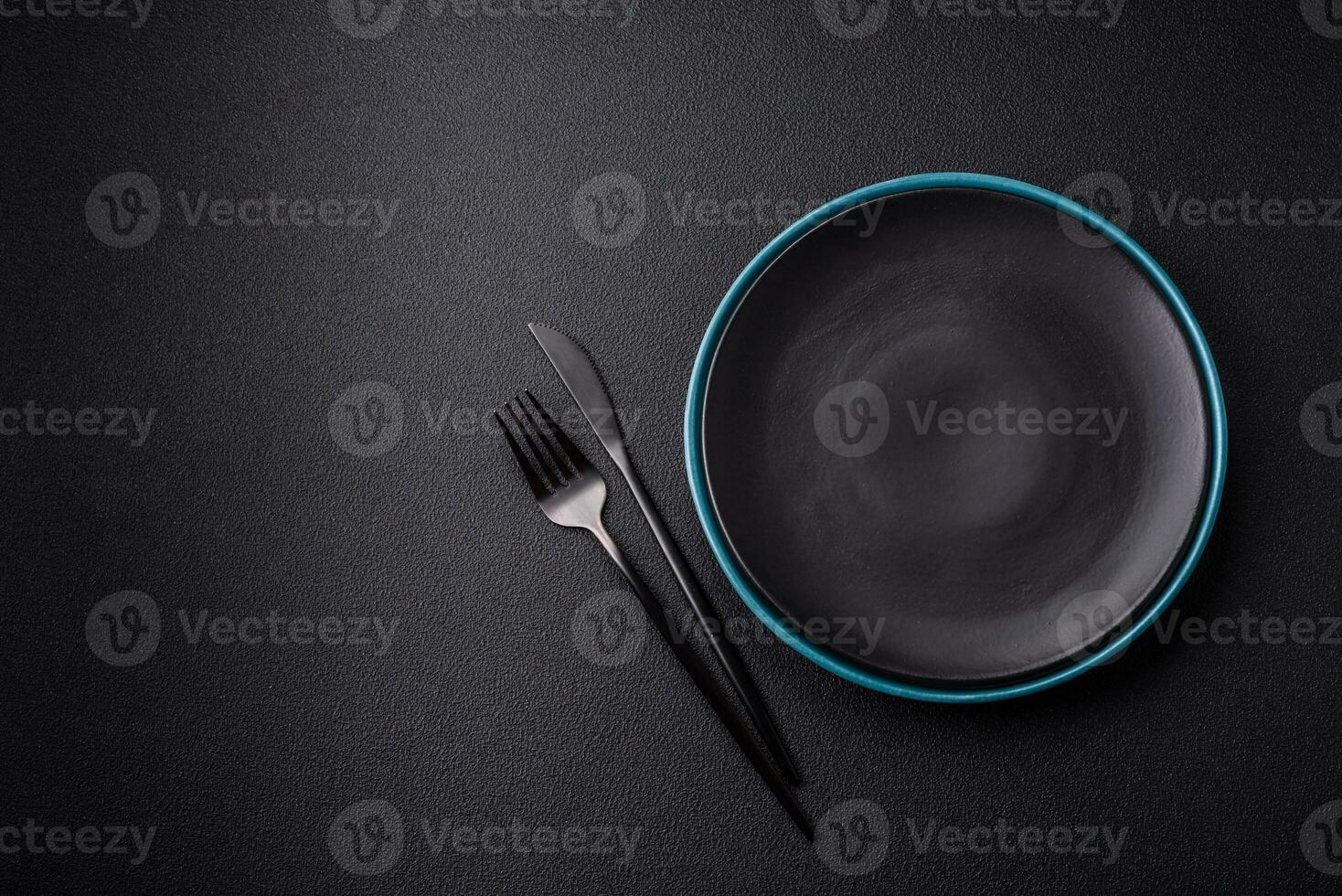 Beautiful empty round ceramic plate on a concrete background photo