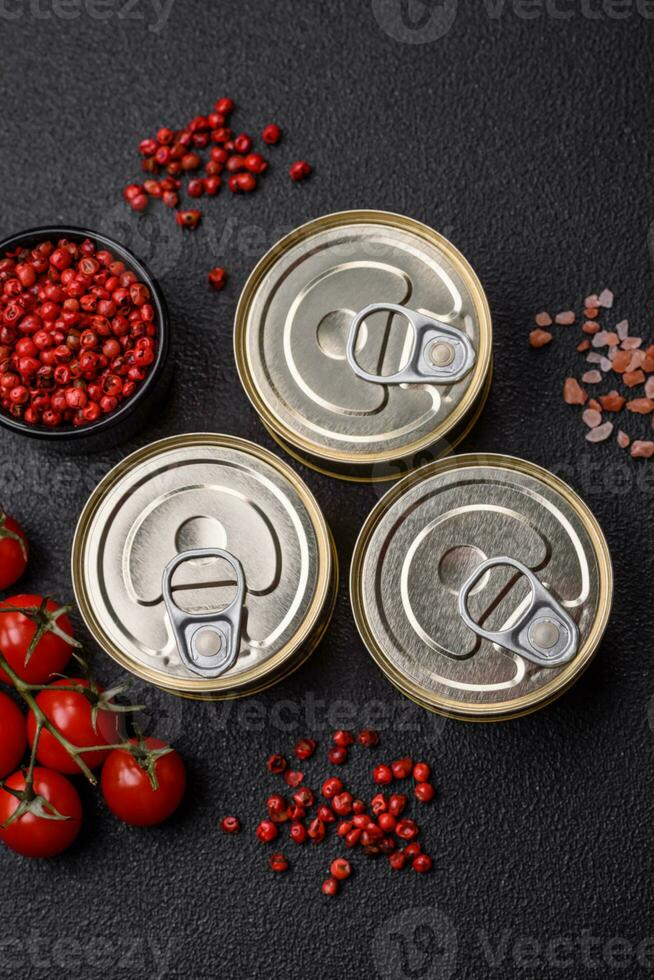 Round metal can with canned fish or meat with a key photo