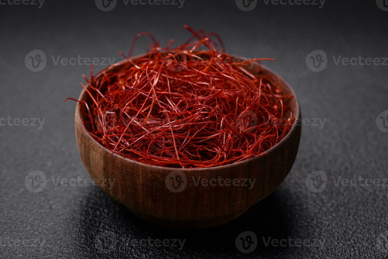 Red thin hot chili threads on a dark background photo