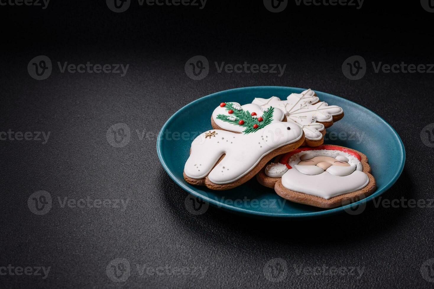 Beautiful Christmas gingerbread cookies on a round ceramic plate photo