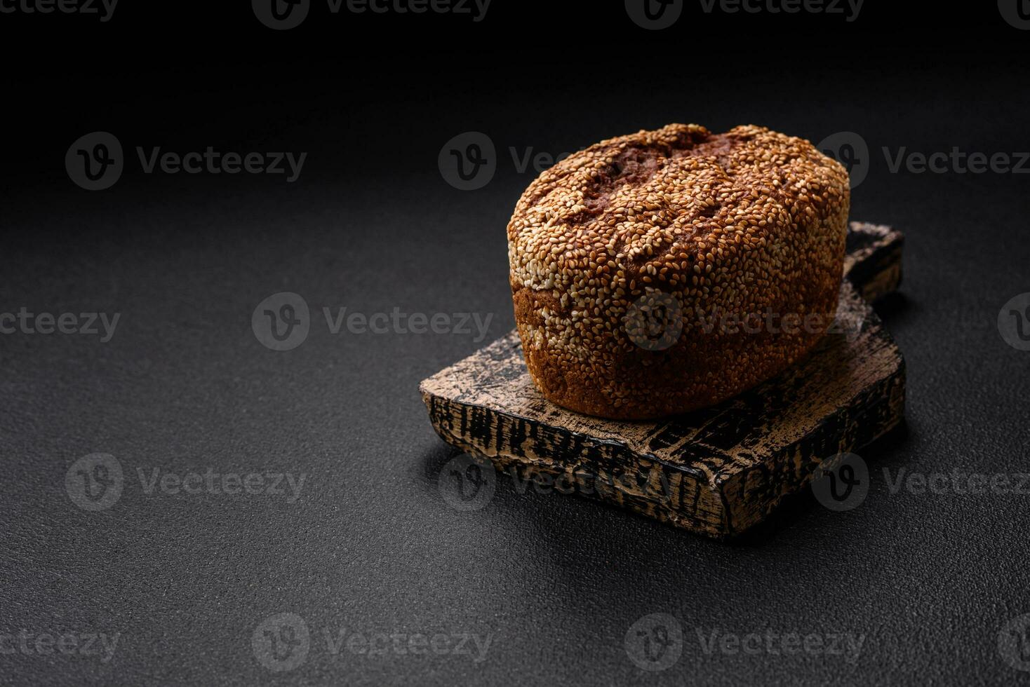 Delicious fresh crispy brown bread with seeds and grains photo