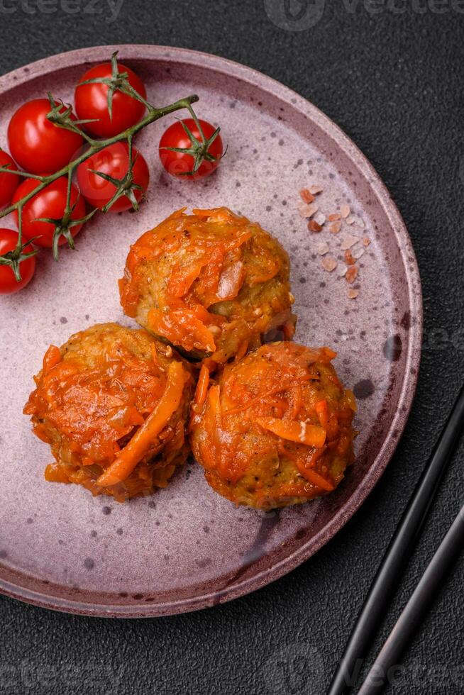 Delicious fresh meatballs from minced meat or fish with tomato sauce photo