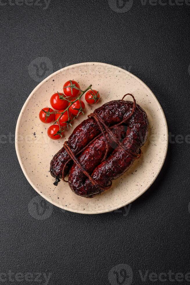 Delicious black blood sausage or black pudding with spices and herbs photo