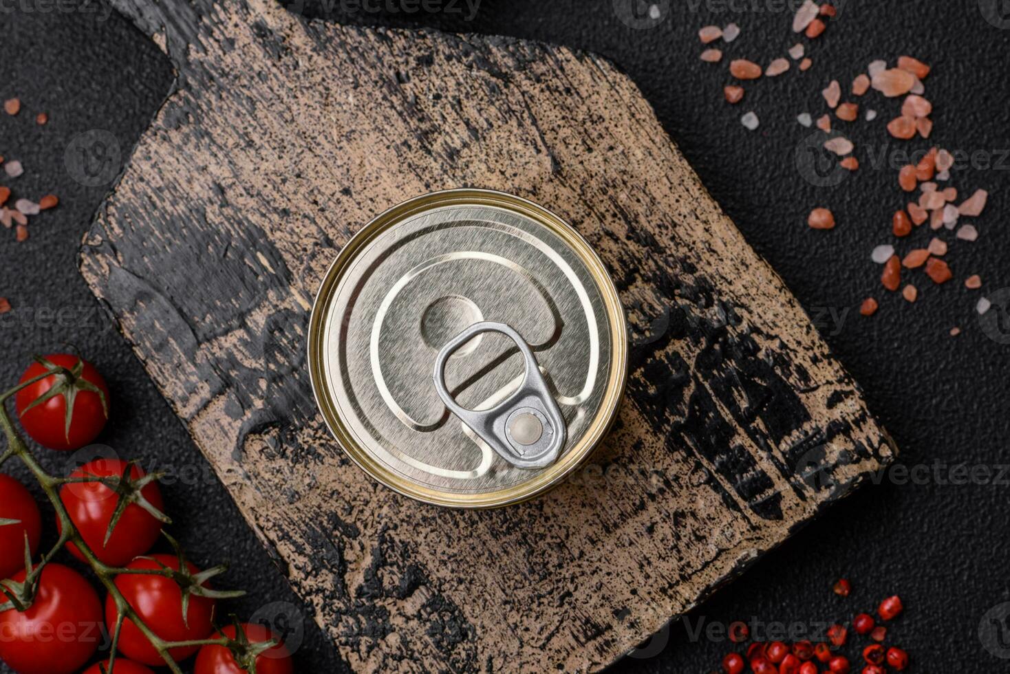 Round metal can with canned fish or meat with a key photo