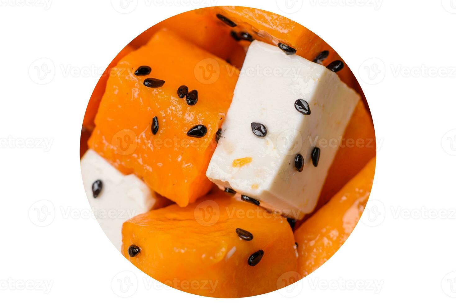 Delicious juicy salad of diced grilled pumpkin with feta cheese, spices and sesame seeds photo