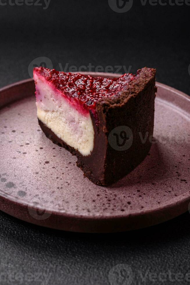 Delicious sweet cheesecake cake with mascarpone cheese, raspberries and jam photo