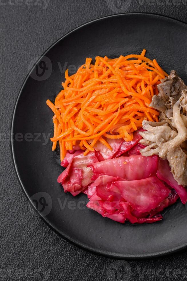 Delicious spicy mushrooms, carrots, cabbage sliced and cooked in Korean style photo