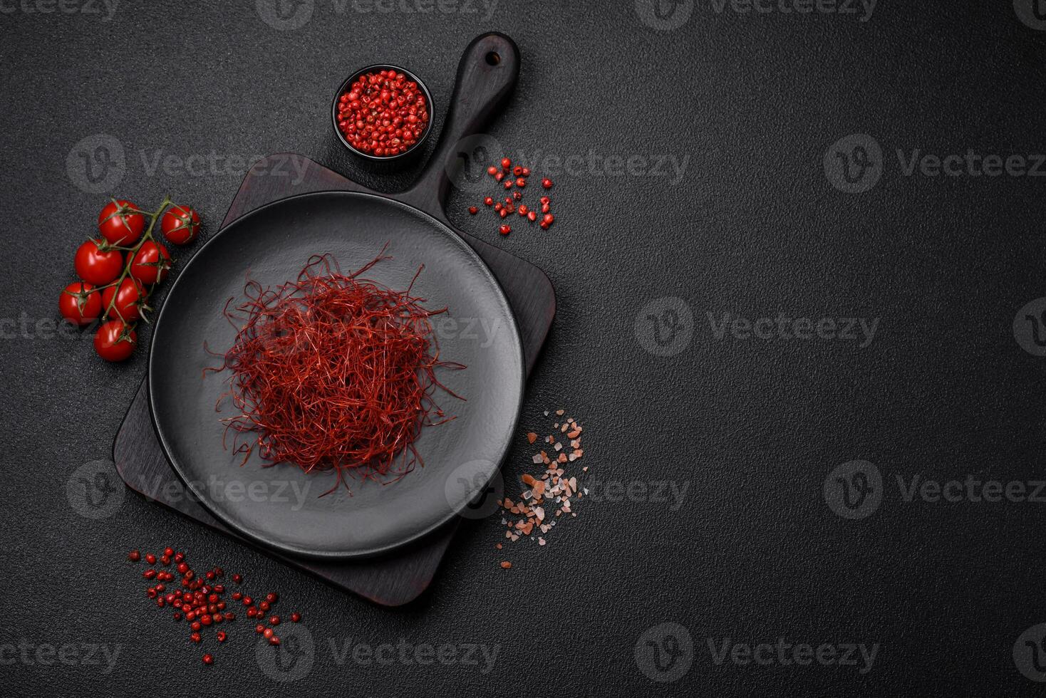 Red thin hot chili threads on a dark background photo
