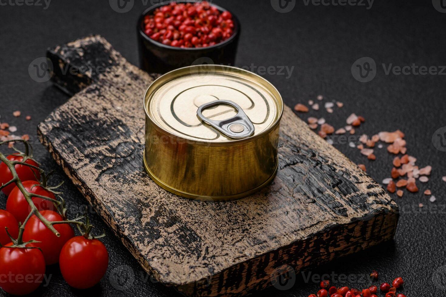 Round metal can with canned fish or meat with a key photo
