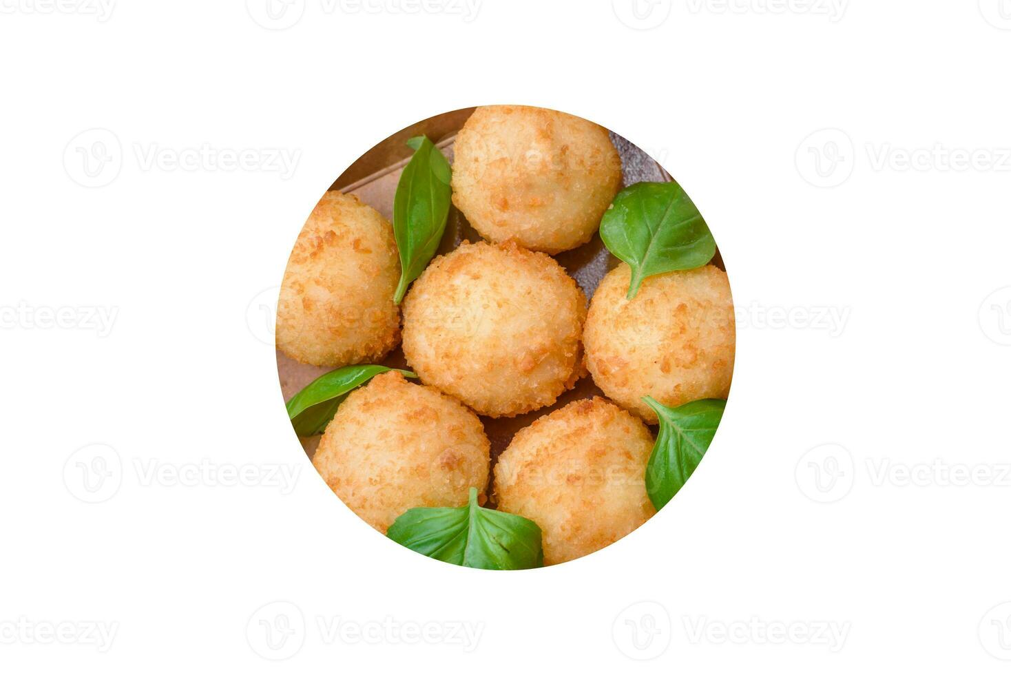 Delicious round balls of mozzarella and parmesan cheese with salt and breaded spices photo