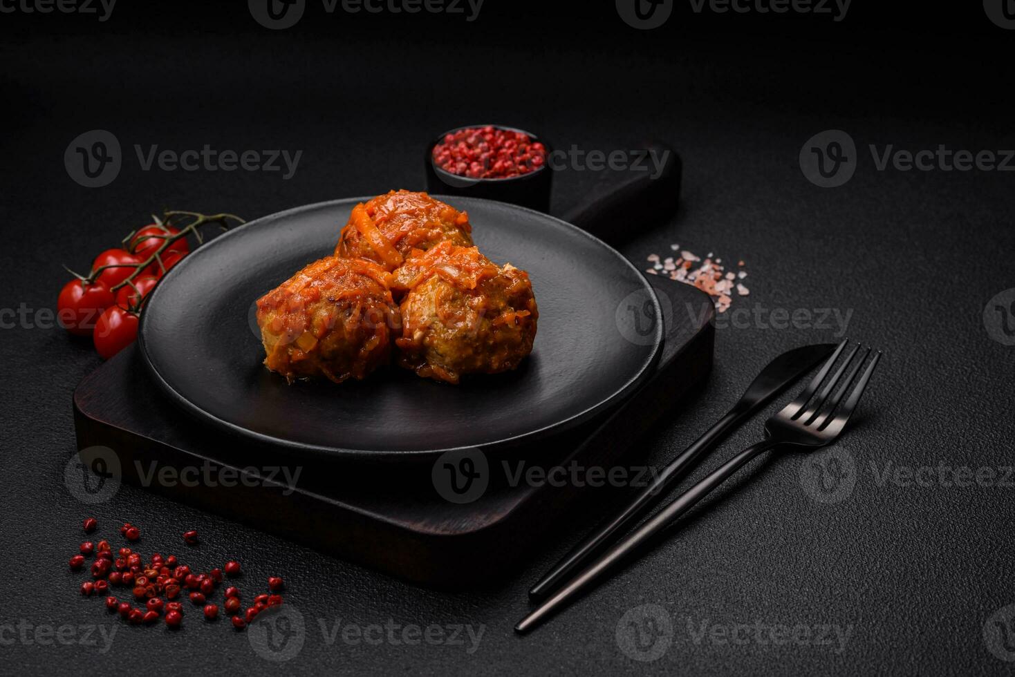 Delicious fresh meatballs from minced meat or fish with tomato sauce photo