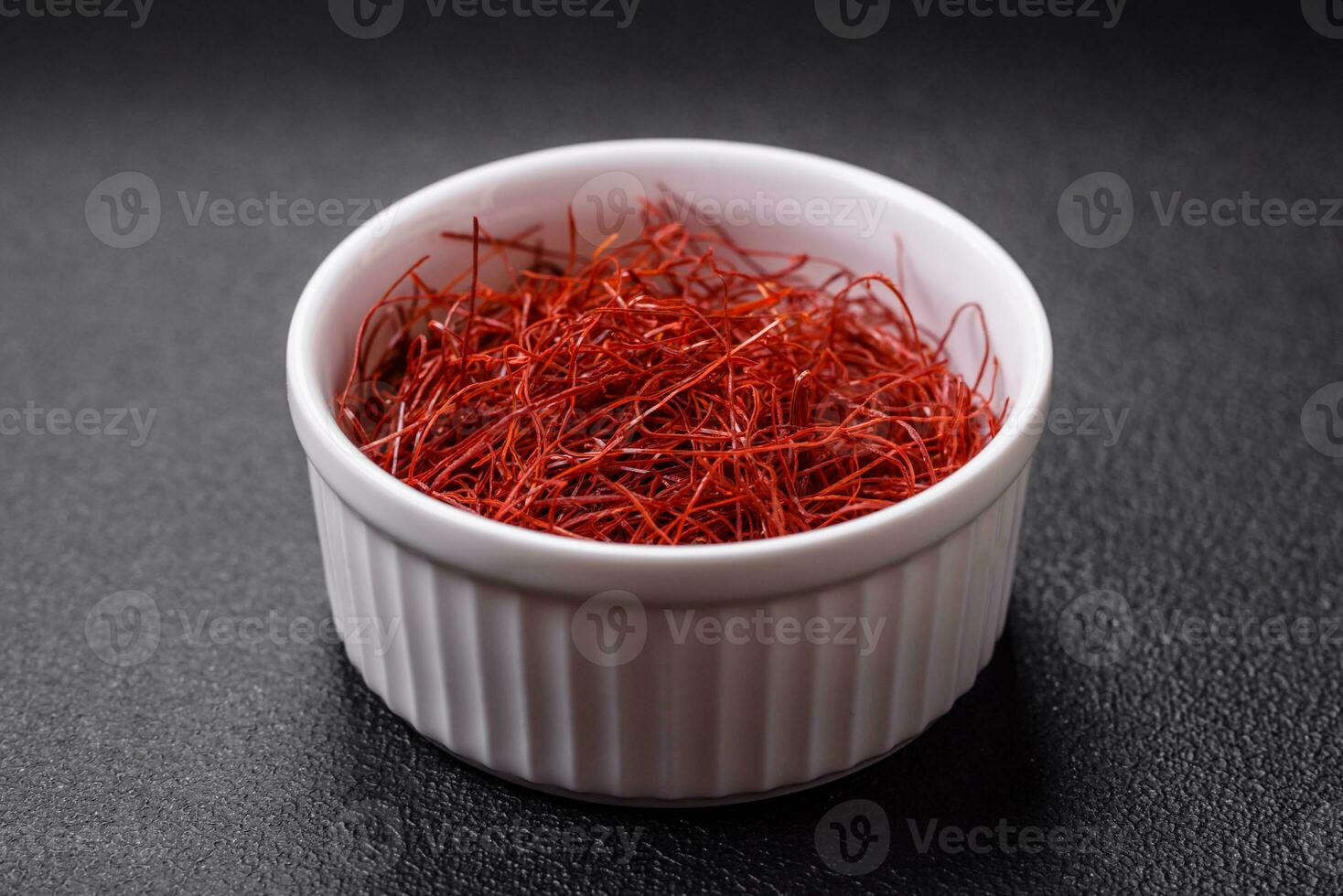 Red thin hot chili threads on a dark background photo
