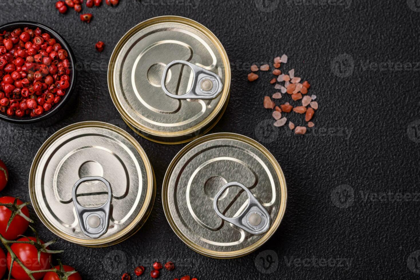 Round metal can with canned fish or meat with a key photo