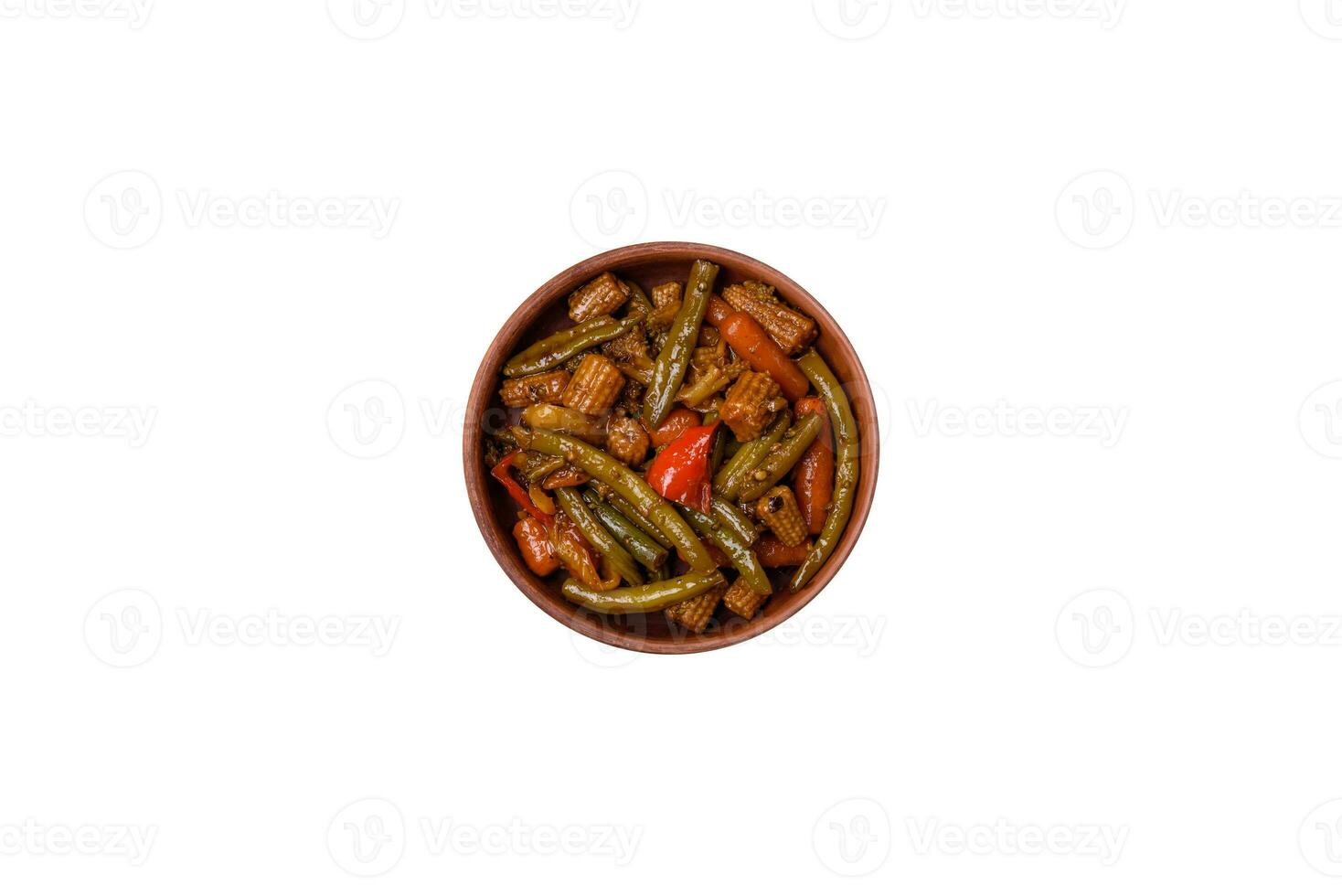 Mix of vegetables corn, carrots, peppers, onions in teriyaki sauce photo