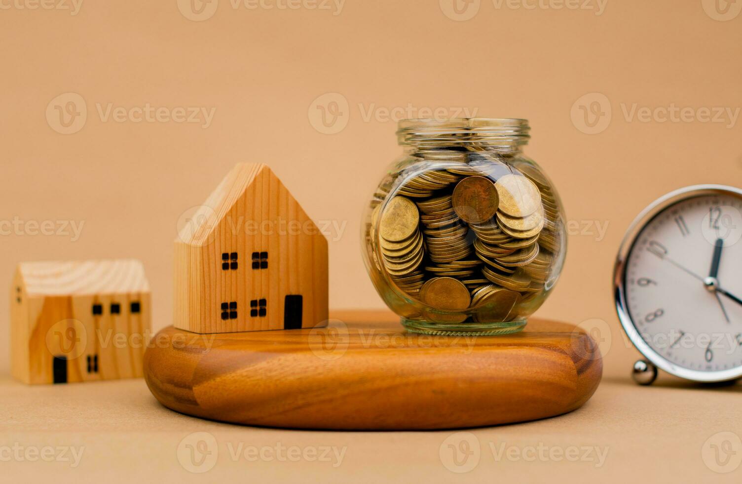 Money, time and house. Savings. Coins in a glass jar. Invest. Financial investment. Cash Loan, Home Loan, Cash Flow, Salary, Money and Financial Investments. photo