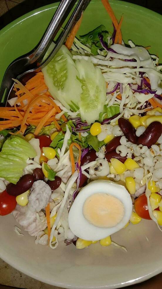 vegetable salad Carrot millet cabbage boiled egg and corn photo