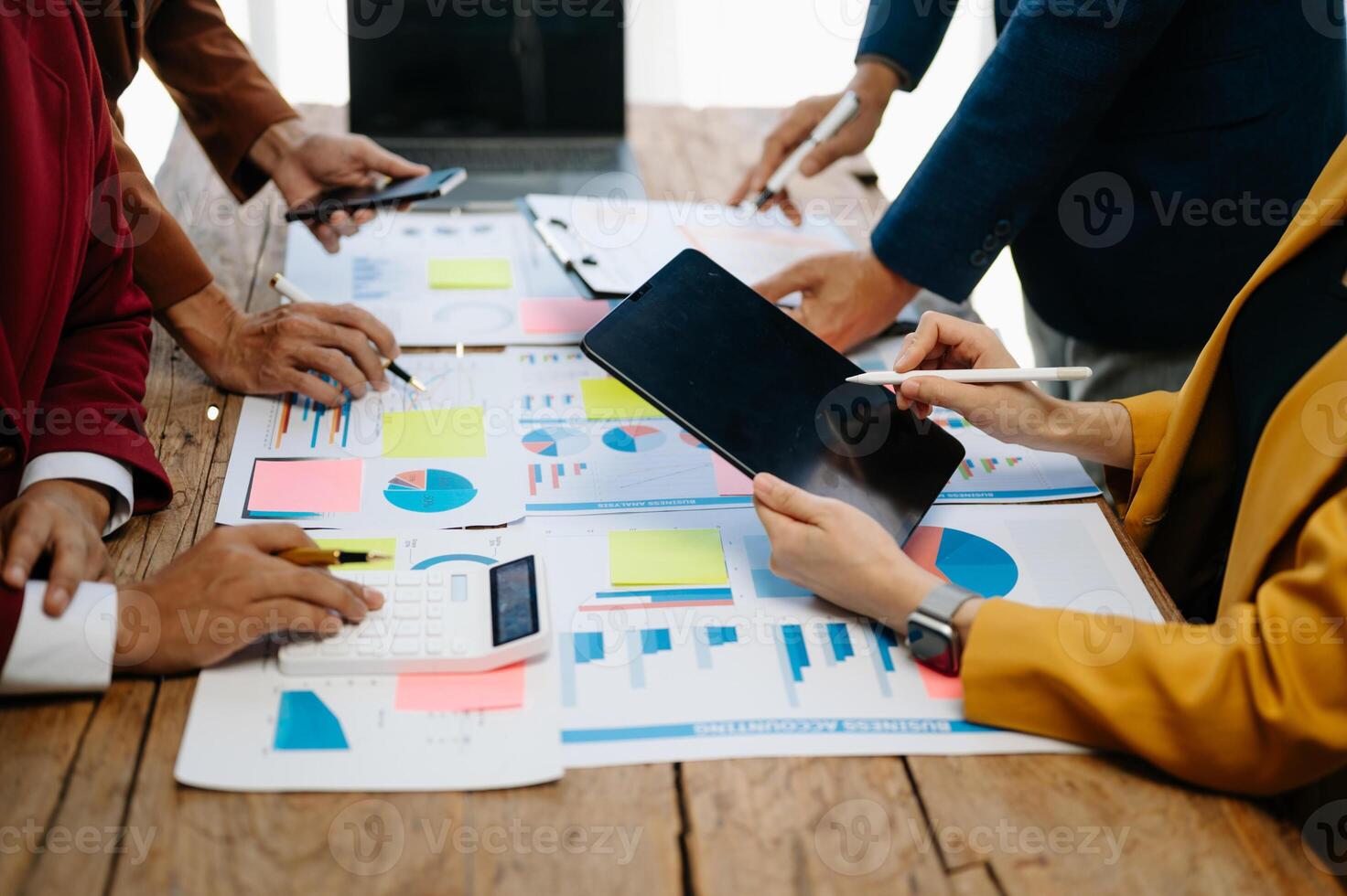 Business team meeting. professional investor working new start up project. Finance task. with smart phone and laptop and digital tablet computer photo