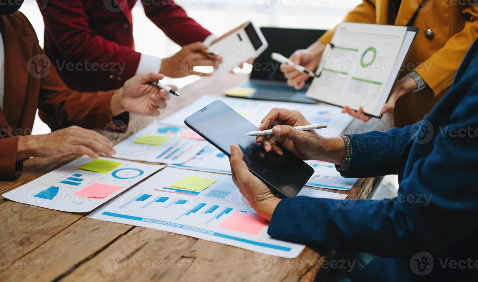 Business team meeting. professional investor working new start up project. Finance task. with smart phone and laptop and digital tablet computer photo