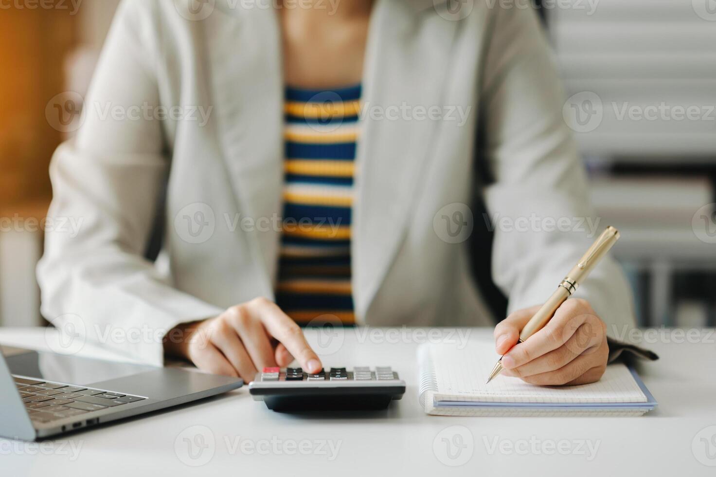 businesswoman hand working with new modern computer and writing on the notepad strategy diagram as concept photo