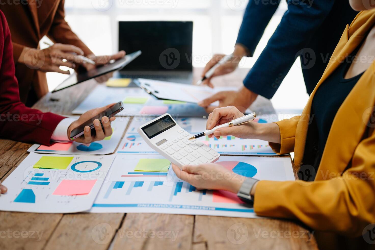 Business team meeting. professional investor working new start up project. Finance task. with smart phone and laptop and digital tablet computer photo