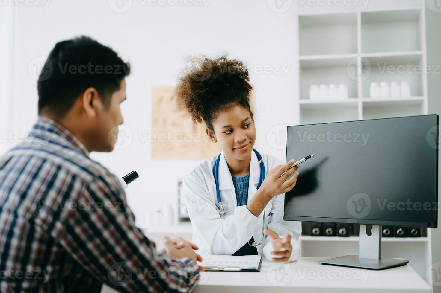 Doctor consulting with patient discussing something and Presenting results on report, Medicine and health care concept. photo