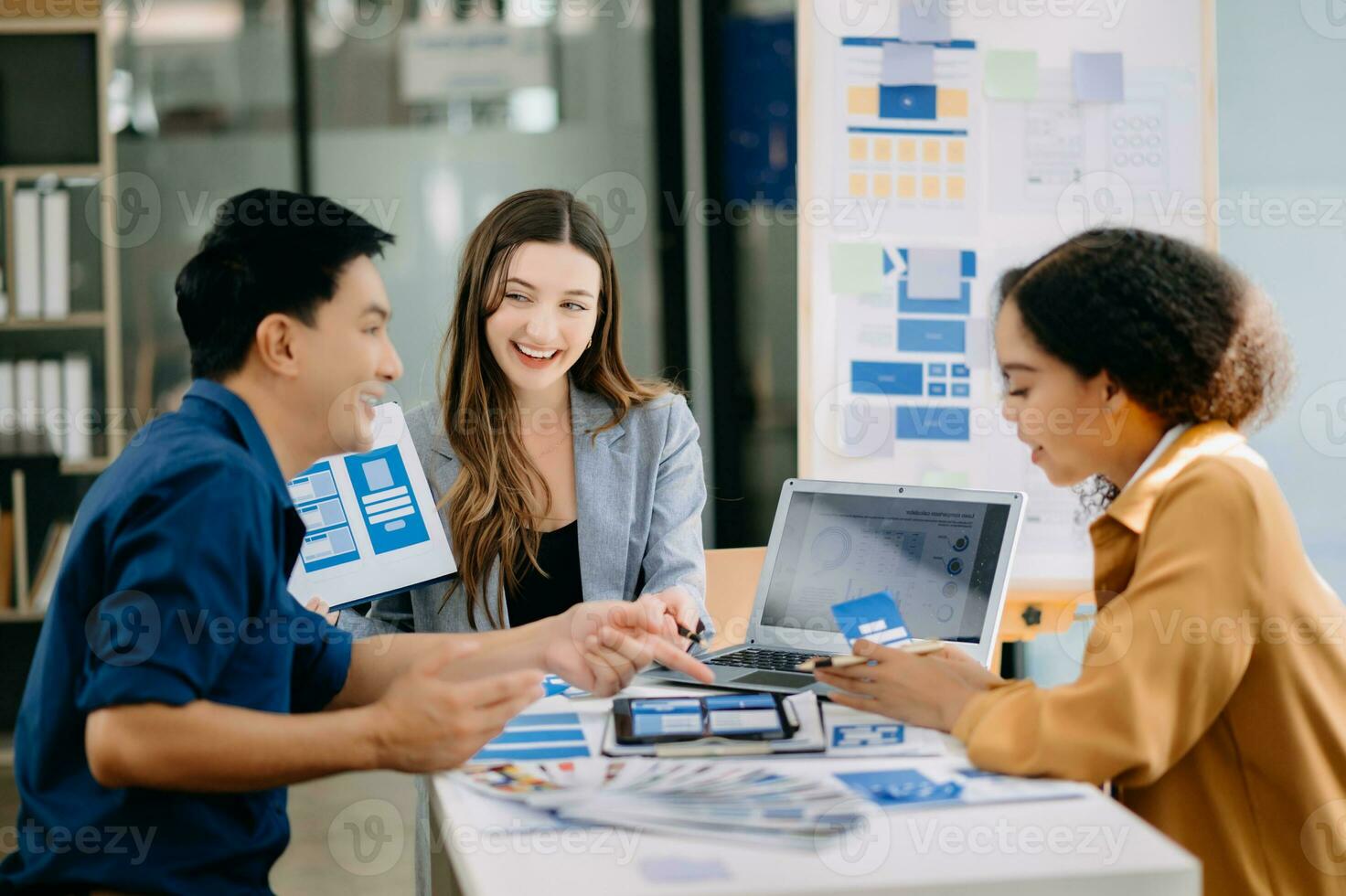 UX developer and ui designer brainstorming about mobile app interface wireframe design with customer breif and color code photo