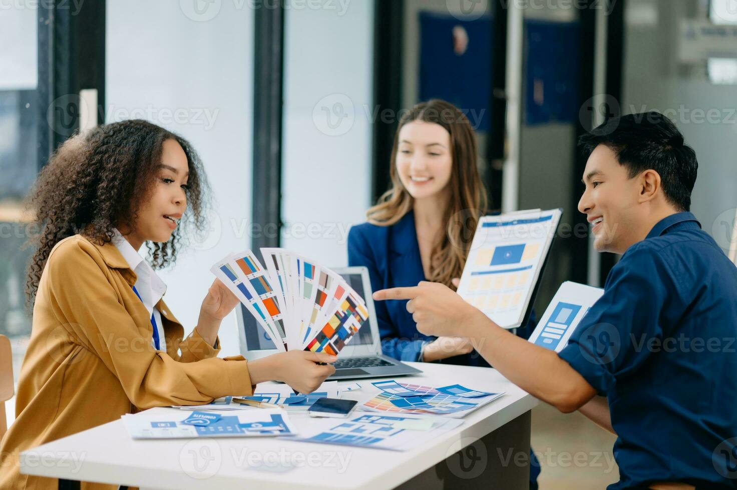 UX developer and ui designer brainstorming about mobile app interface wireframe design with customer breif and color code photo