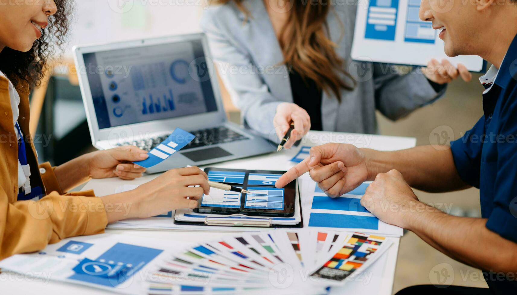 UX developer and ui designer brainstorming about mobile app interface wireframe design with customer breif and color code photo