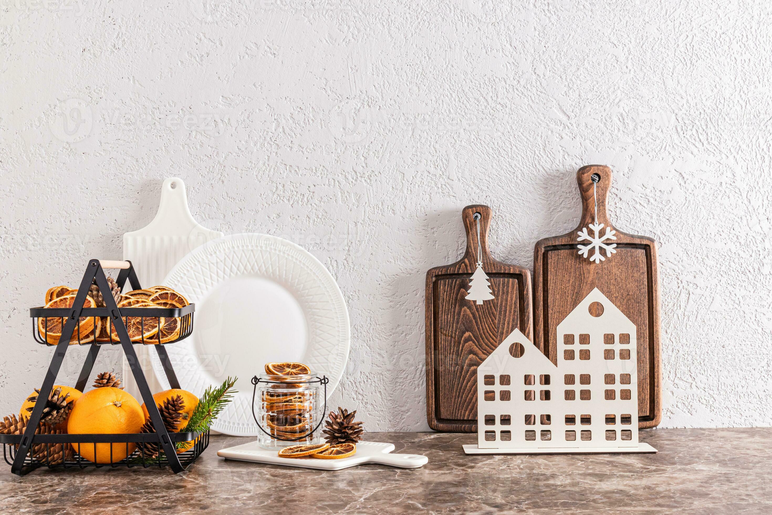 the concept of New Year's decor of a modern kitchen in light colors. front  view of the countertop with kitchen utensils and decorations 13941444 Stock  Photo at Vecteezy