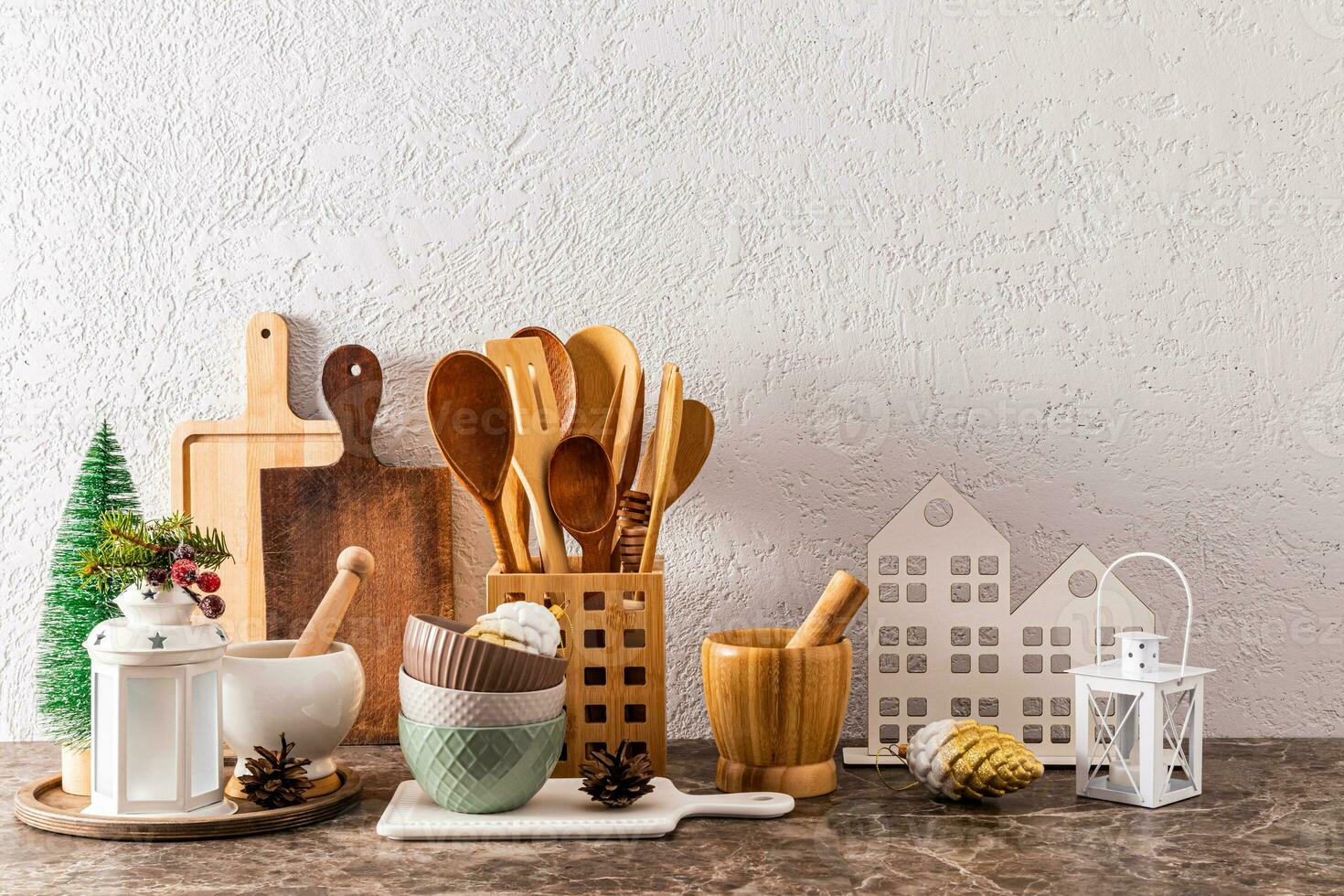 Beautiful festive Christmas kitchen background with decor elements on kitchen stone countertop. A copy space. photo