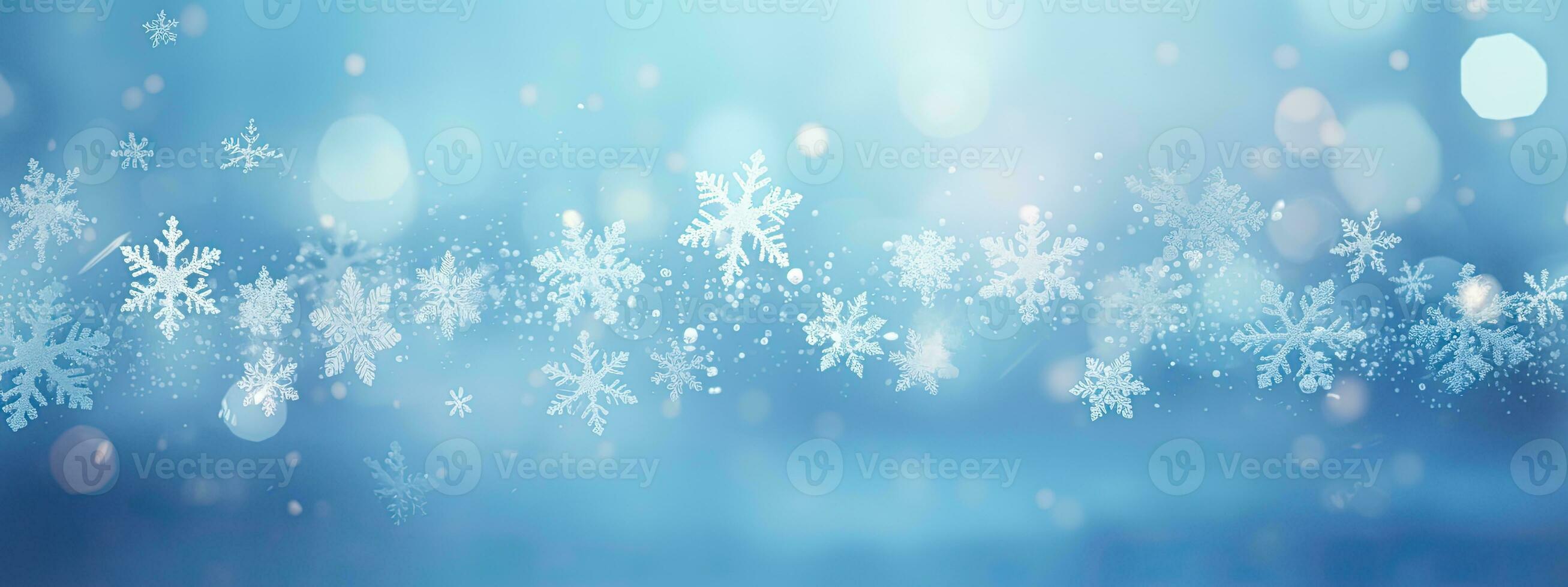 falling snowflakes and ice flakes on a light blue winter backdrop photo
