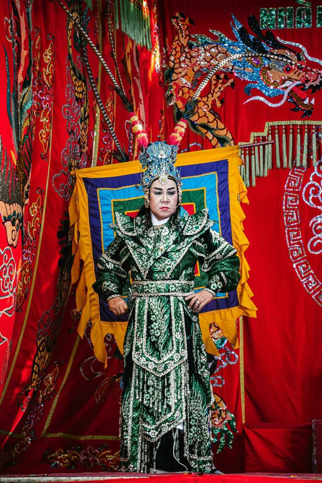 Ho Chi Minh City, Vietnam - August 19, 2023 Artists performing Vietnamese classical opera as know as Hat Boi in Binh Thanh District photo