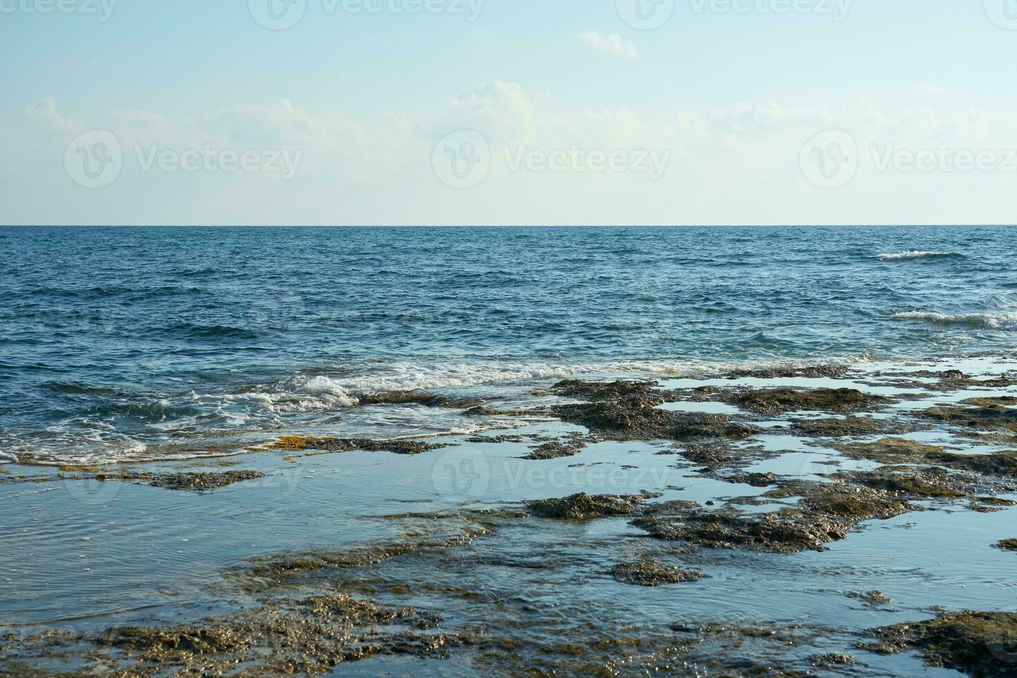 The stone coast of the Mediterranean Sea in Cyprus. photo