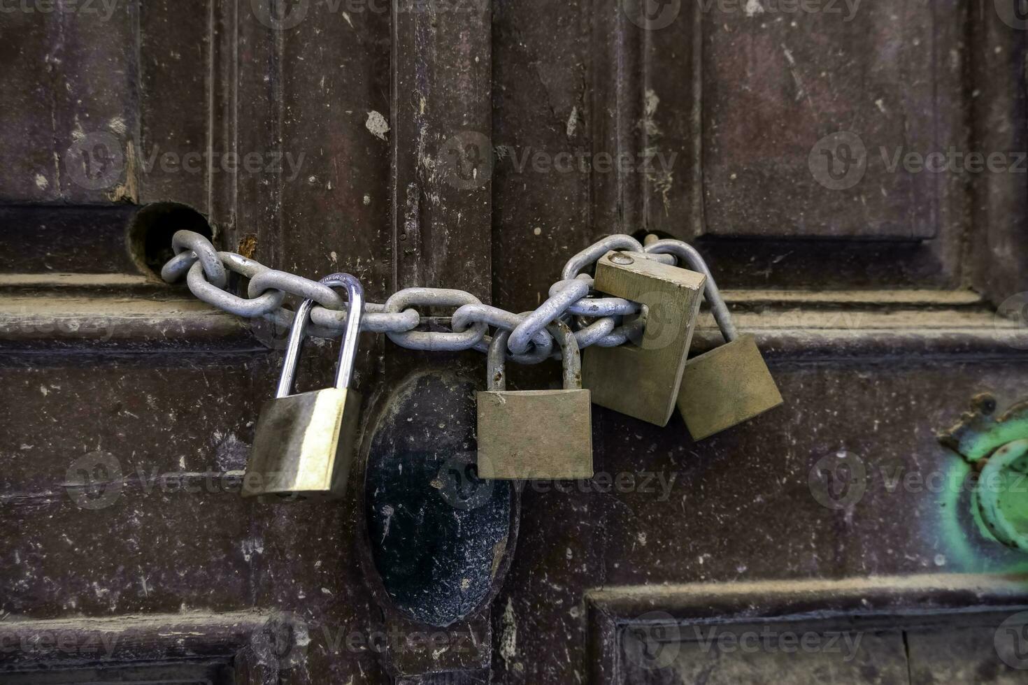 Old padlocks closed with chain photo