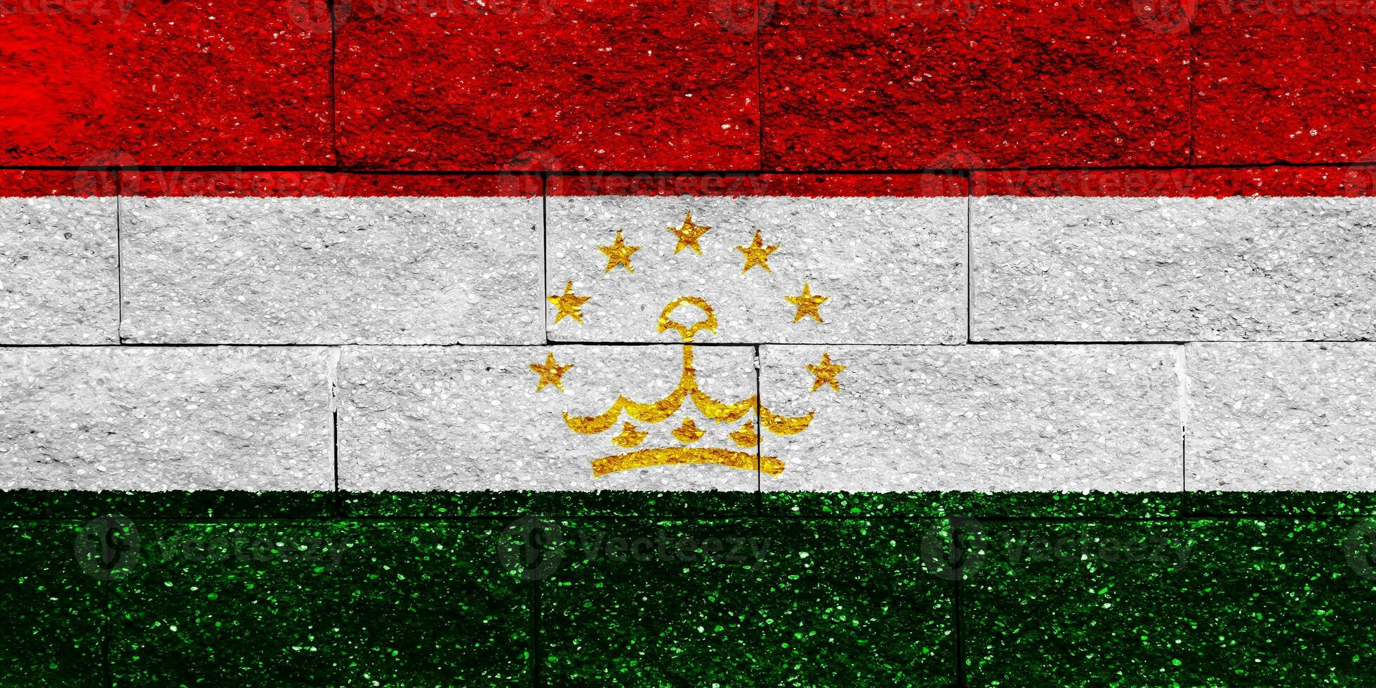 Flag of Republic of Tajikistan on a textured background. Concept collage. photo