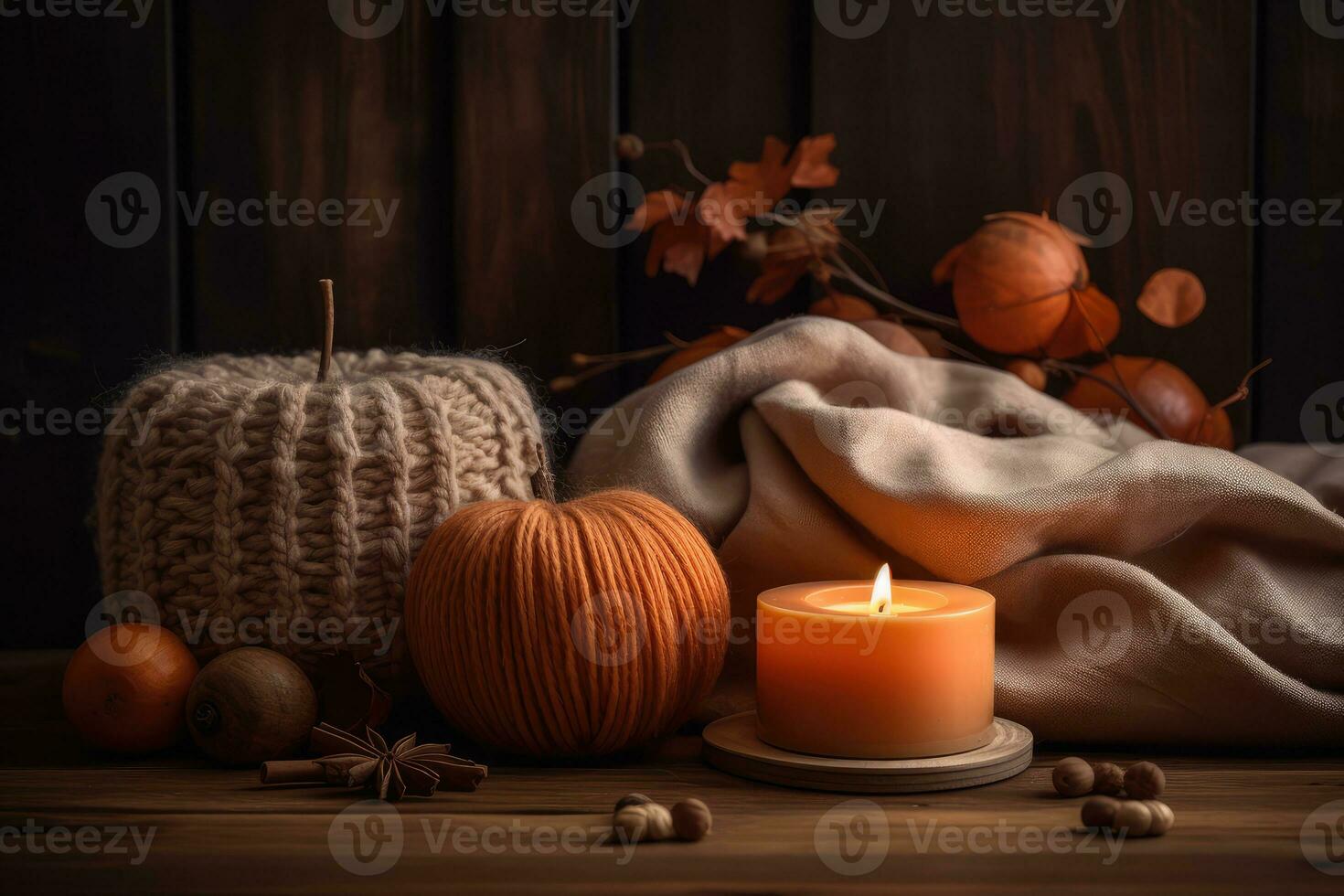 Knitted woolen pumpkins and candle on wooden background, cozy autumn background. Generative AI photo