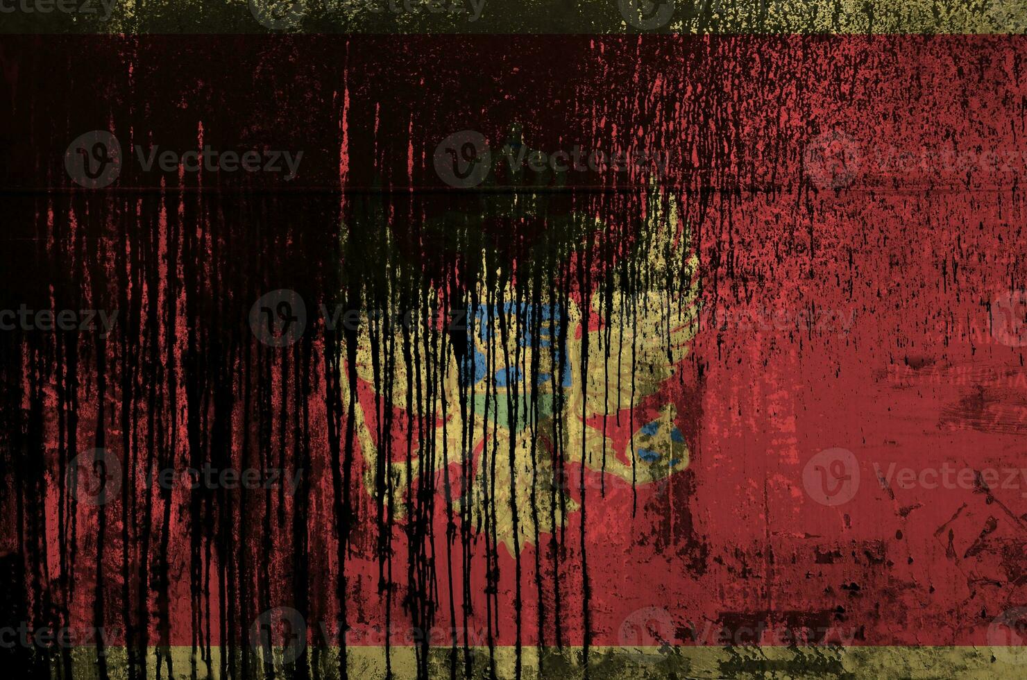 Montenegro flag depicted in paint colors on old and dirty oil barrel wall closeup. Textured banner on rough background photo