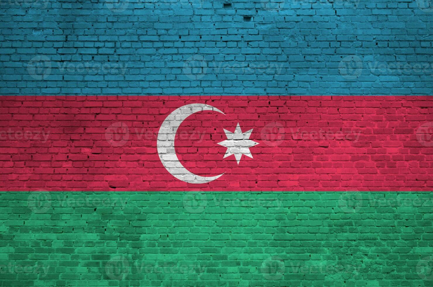 Azerbaijan flag depicted in paint colors on old brick wall. Textured banner on big brick wall masonry background photo