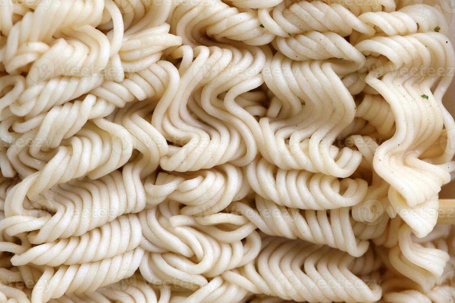 Instant cooking noodles macro texture in boiled condition photo